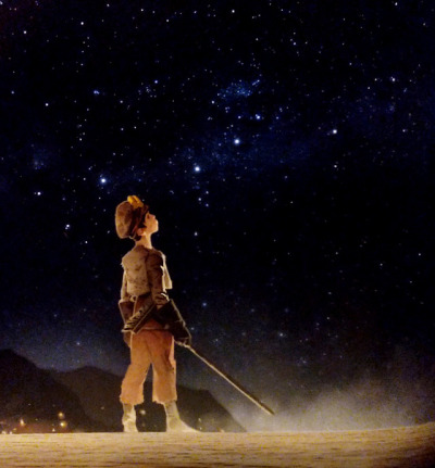 A fantasy-style drawing of a young boy, dressed in dirty brown clothes and holding a broom, looking up at the night sky filled with stars.